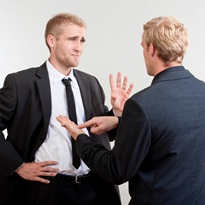 ywo you businessmen standing, discussing, arguing - isolated on light gray