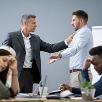 Two Male Colleagues Fighting In Office